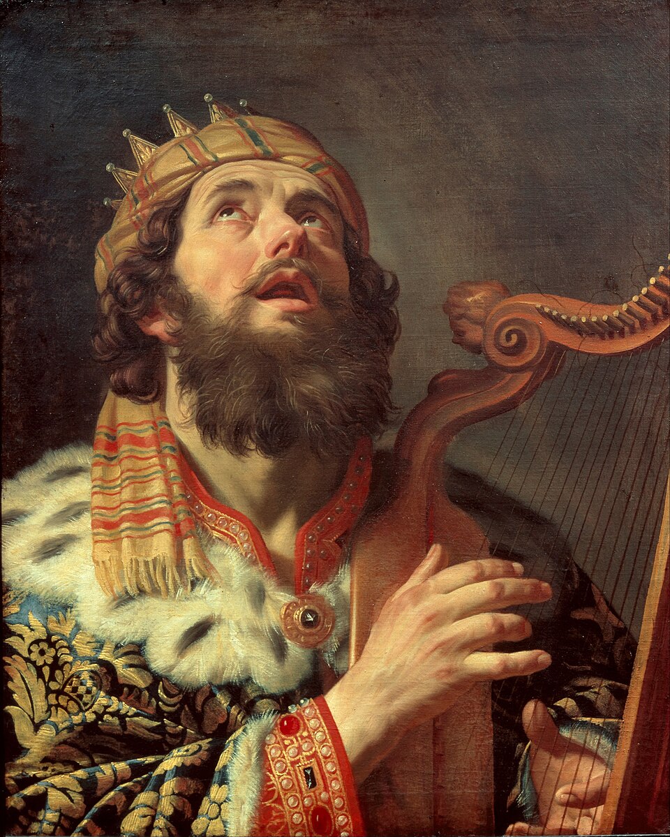 Painting of King David, an old bearded man in a fur-trimmed robe, playing a gold harp