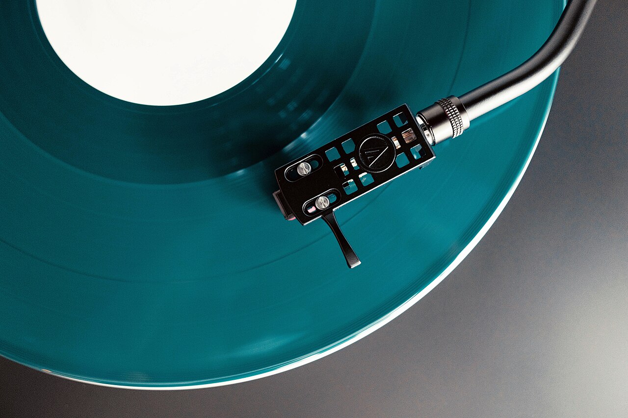 A record player playing a coloured vinyl record